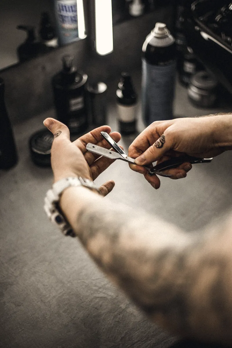 Barber preparing a straight razor